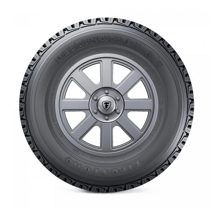 Firestone Destination A/T montado en pickup en camino de tierra